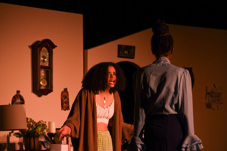 two students on stage for one of AATAT's performances