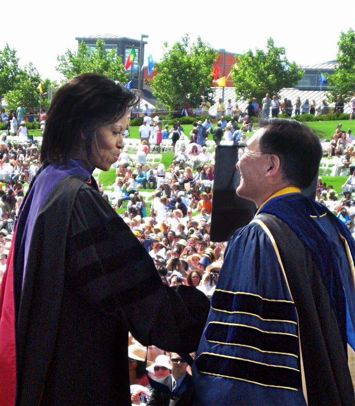 Steve Kang and Michelle Obama in commencement regalia