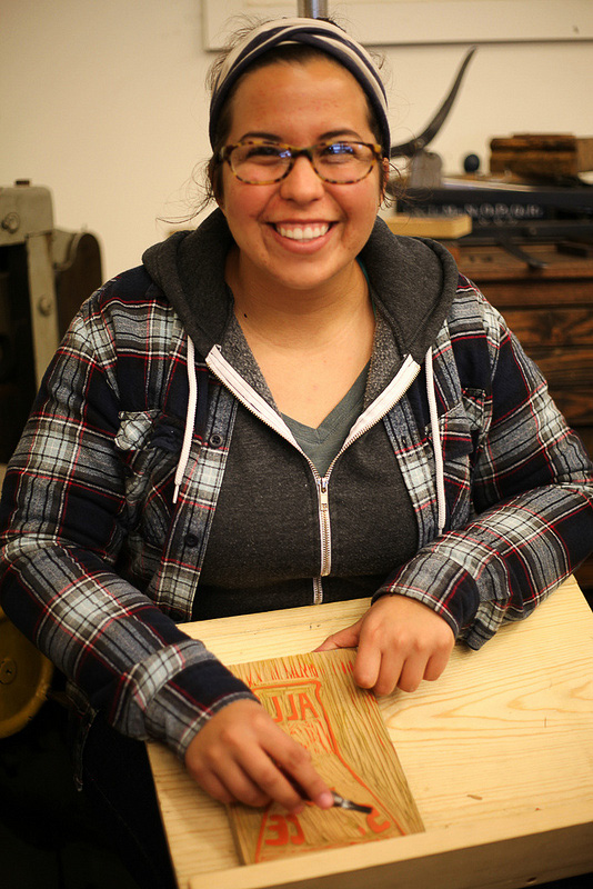 Paolina Fisher carves a linoleum block