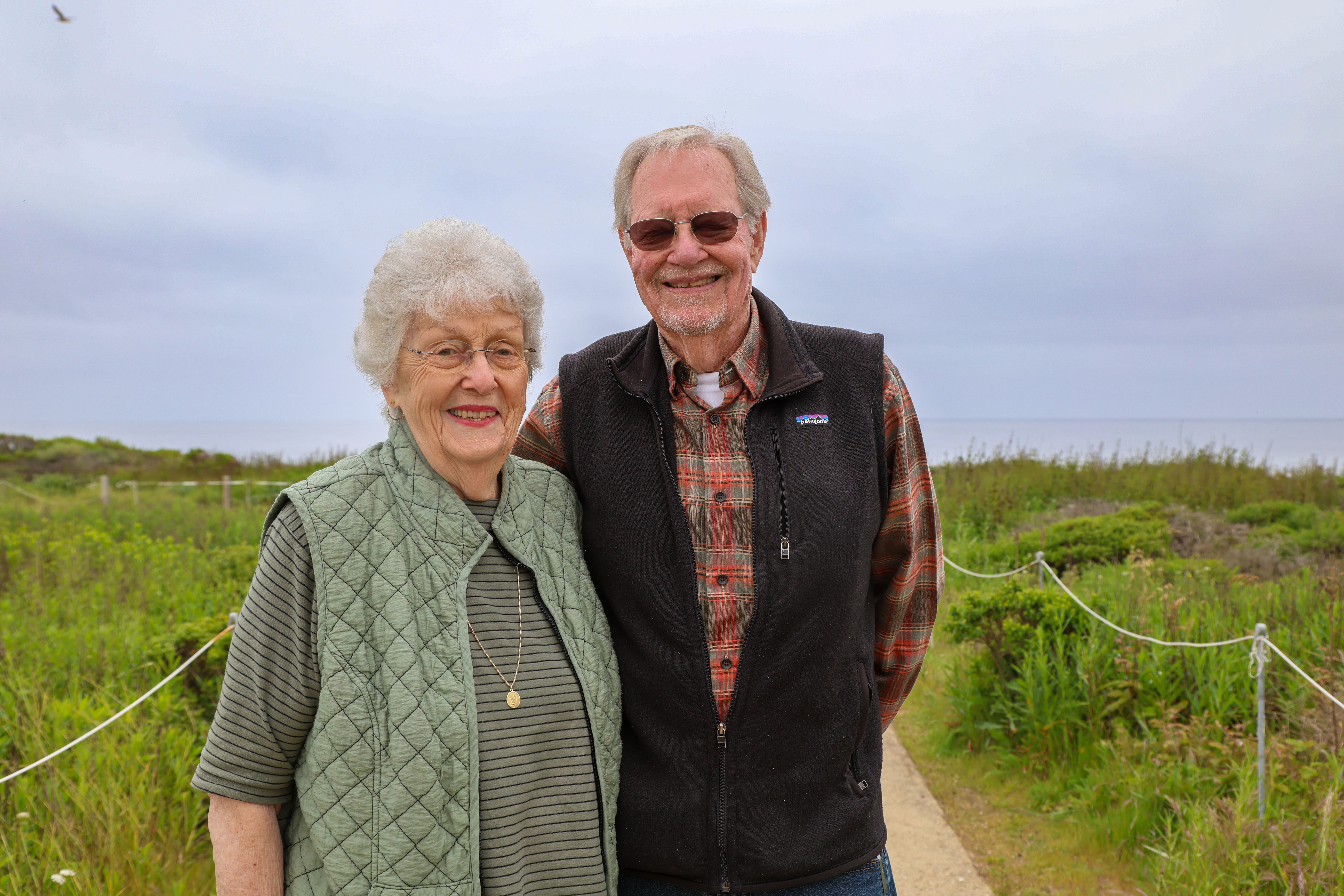 Nancy Pascal stands next to her husband Roland