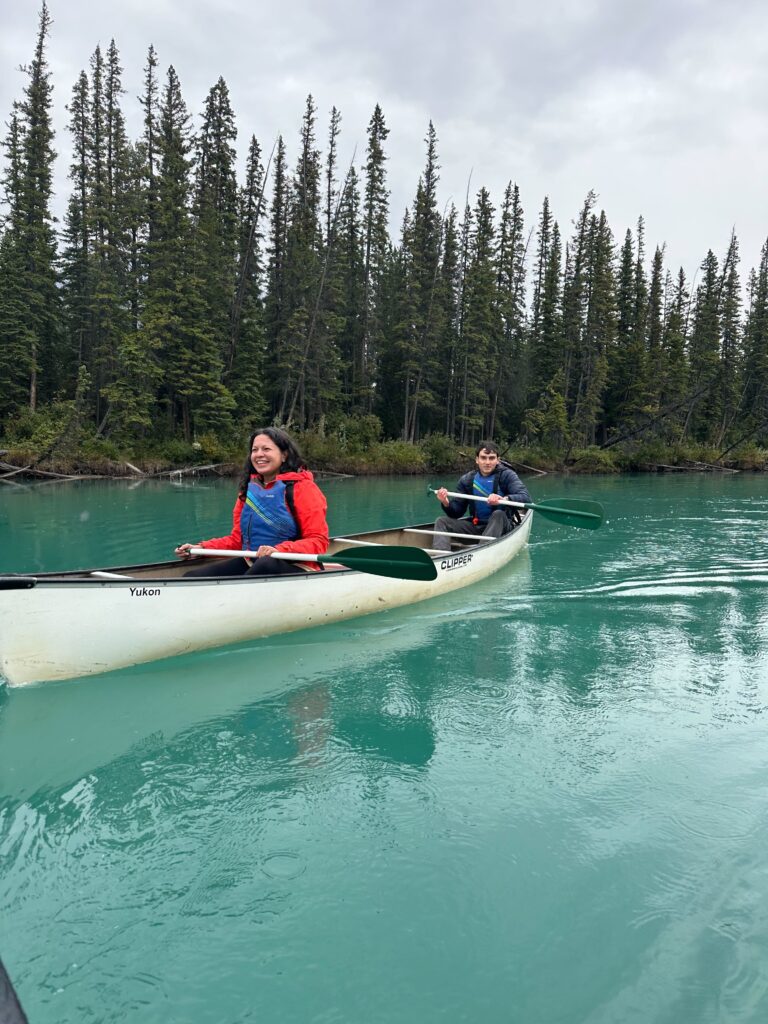 Researchers kayaking on a river