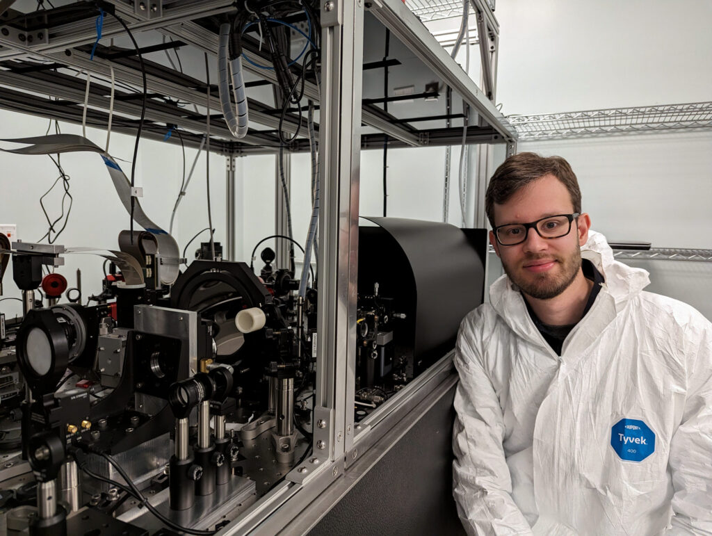 Emiel Por posing next to the instruments.