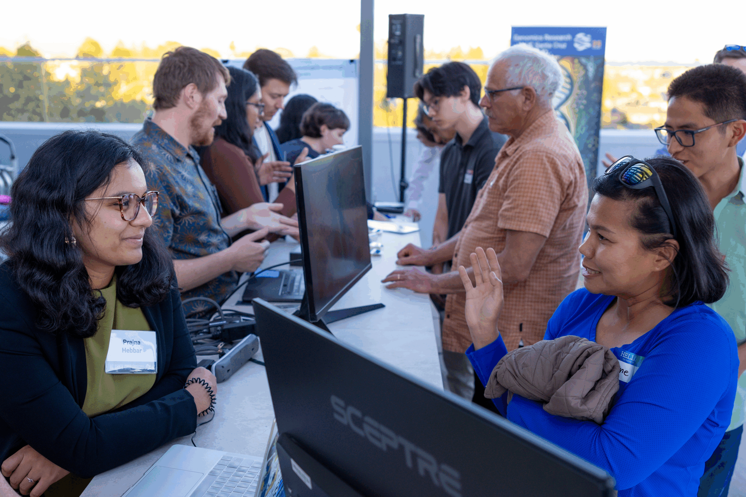 A table of researchers engaged in conversation with four guests