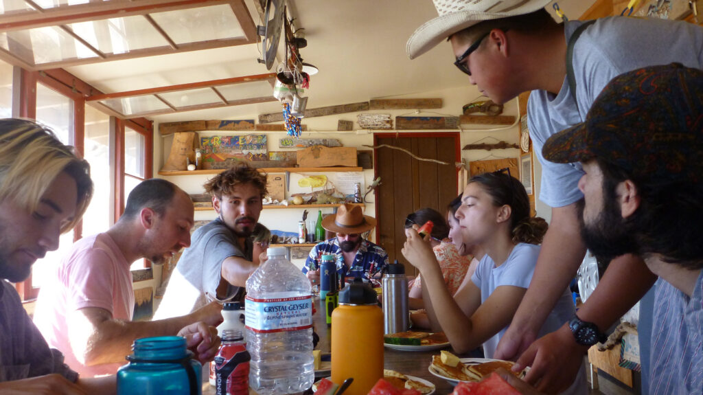Students eat breakfast at Norris Camp in the Granite Mountains.
