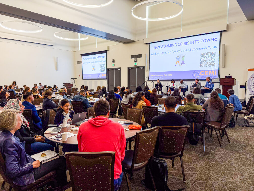 CEMI convening presentation with attendees at tables listening