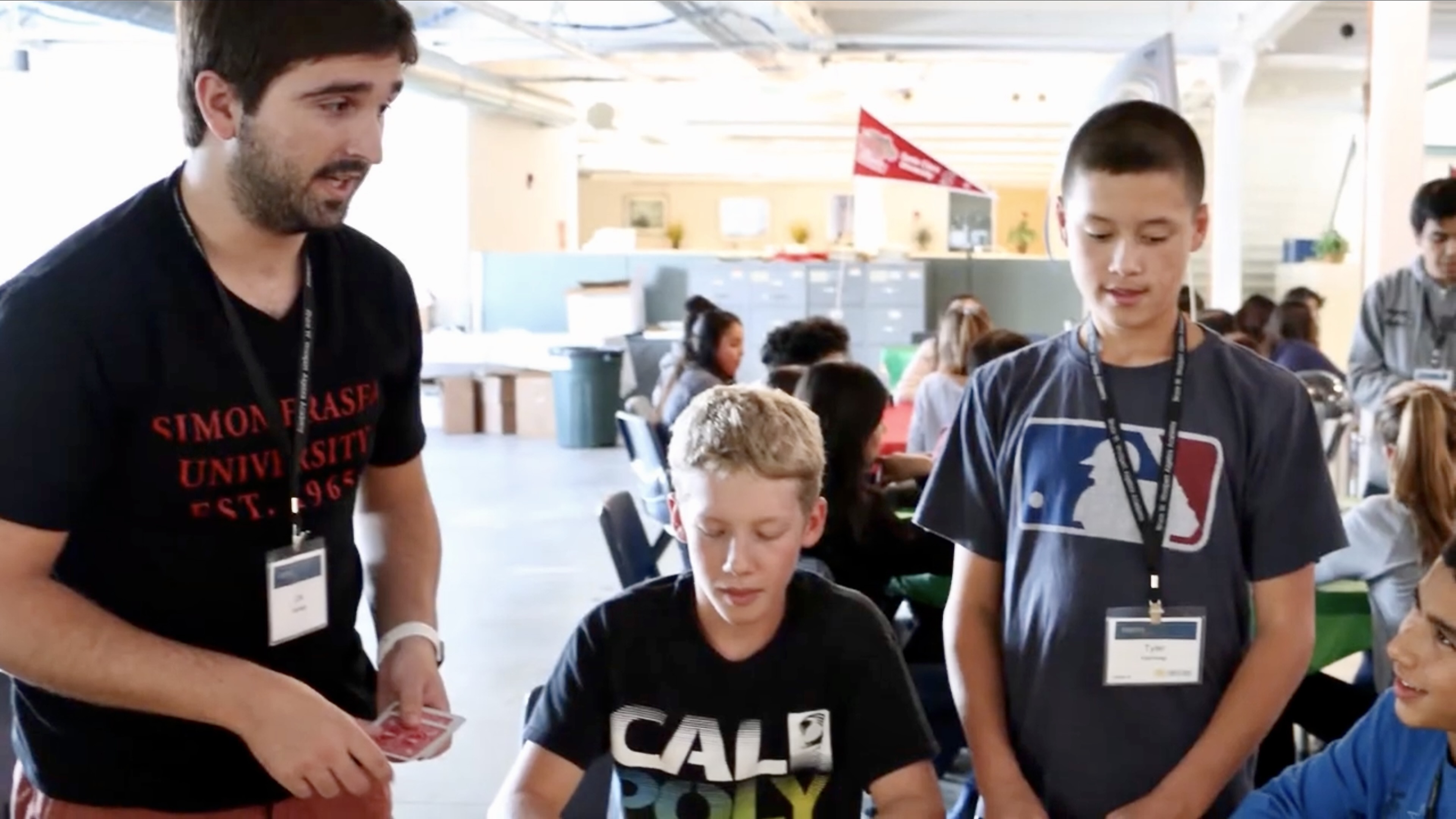 Teacher speaking to students in a classroom