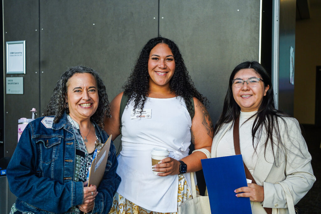 Two attendees with ist staff member Erika Katske