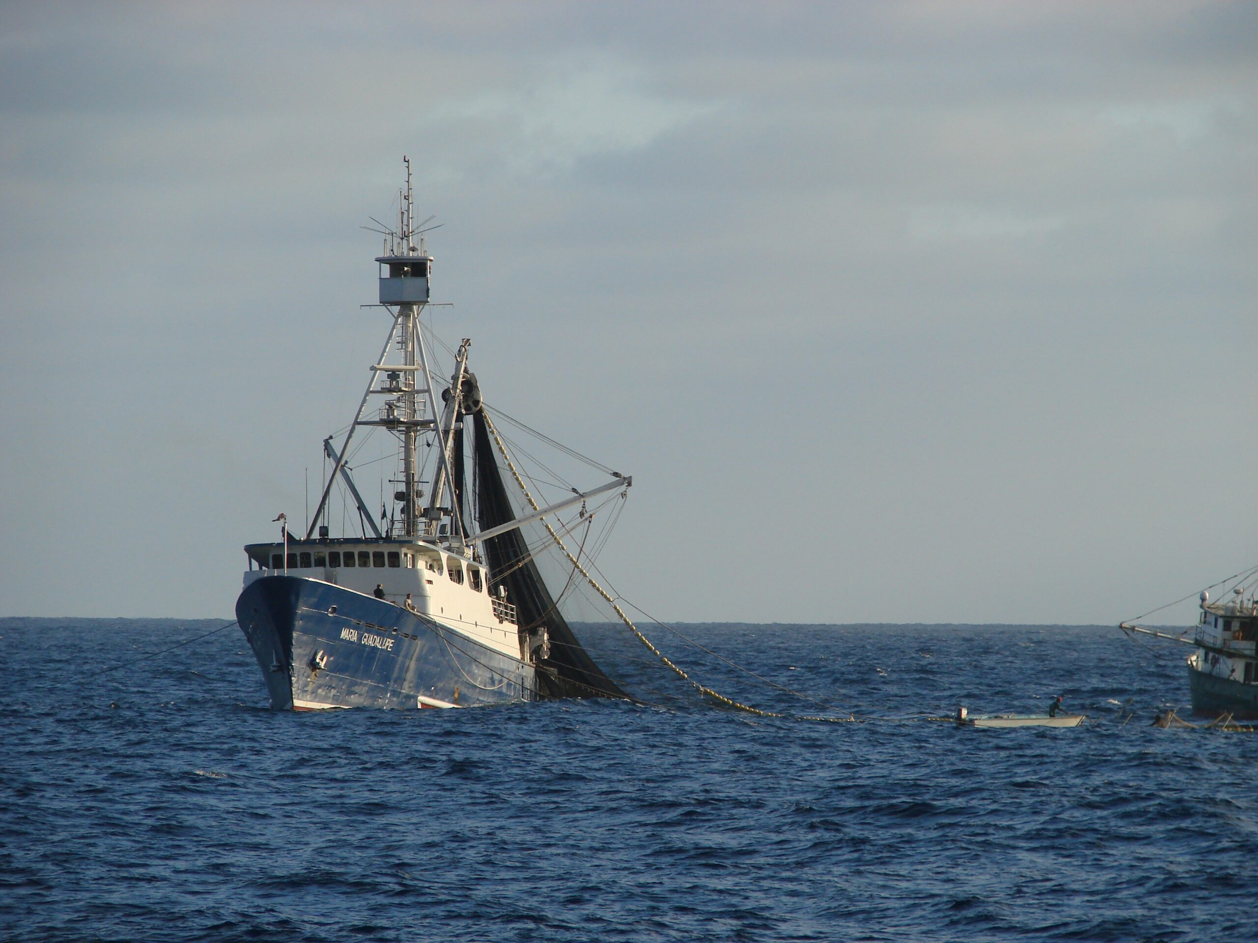Fishing vessel equipped with large net on the ocean