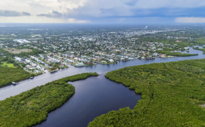 Aerial shot Florida homes surrounded by mangroves