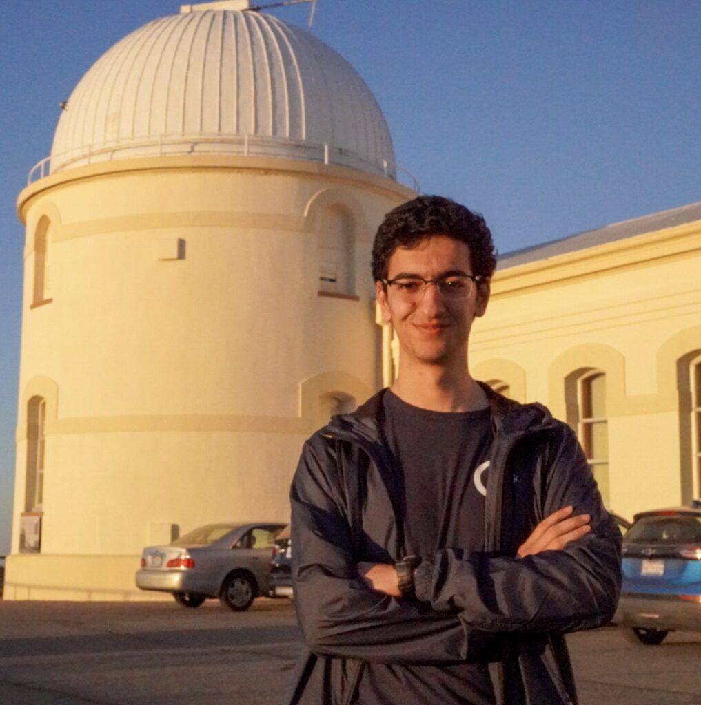 Arian Moghni standing in front of observatory