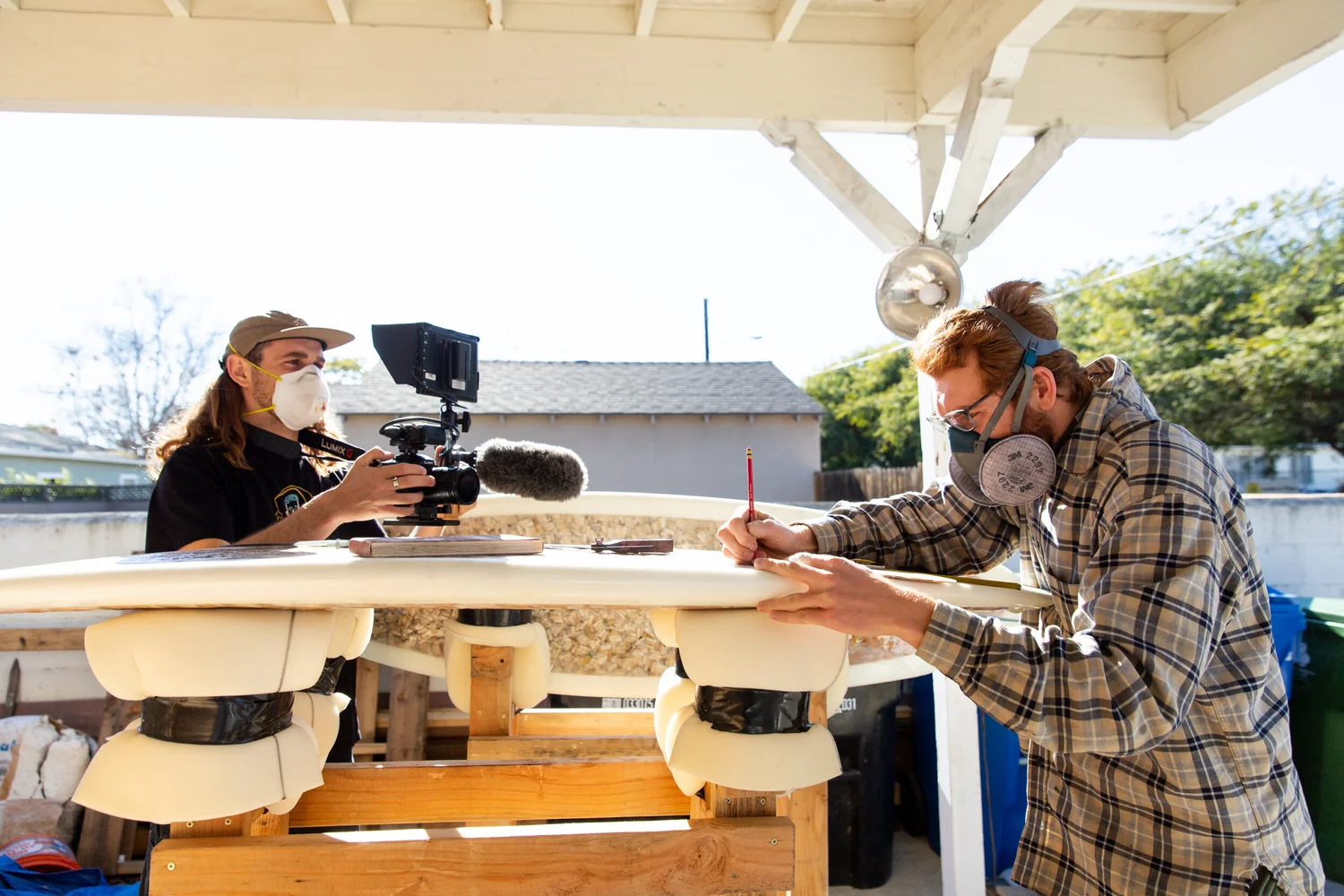 Ben Judkins films Taylor Lane creating the surfboard made of cigarettes