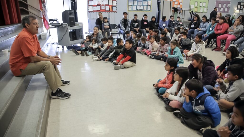 Ramon Resa speaks to a room full of students.