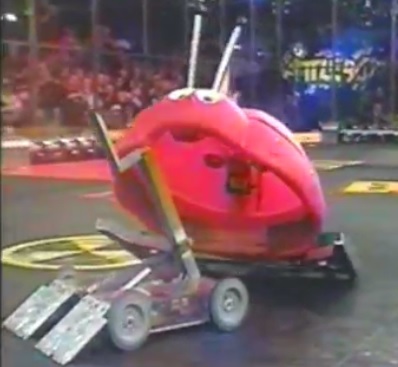 A close up of a young Lisa Winter's robot in the arena 