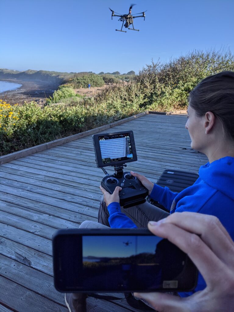 Woman remotely operating a drone