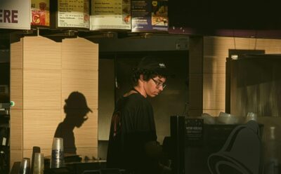 worker stands at fast food counter