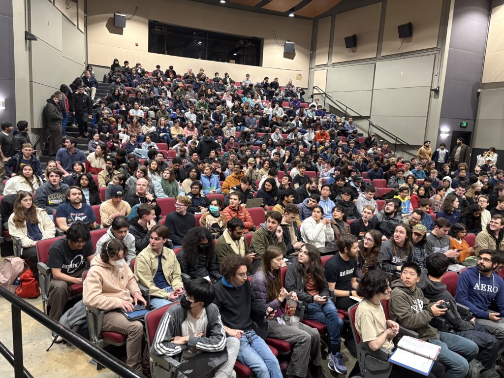 Auditorium full of audience members in their seats