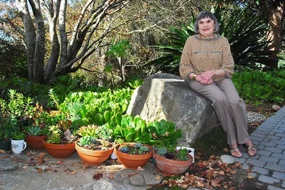 Maxine Lane next to succulents she grew