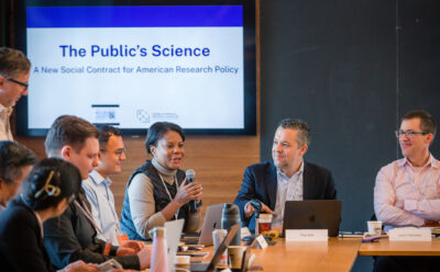 Alondra Nelson holds a mic and speaks amongst other participants at the Public's Science launch event