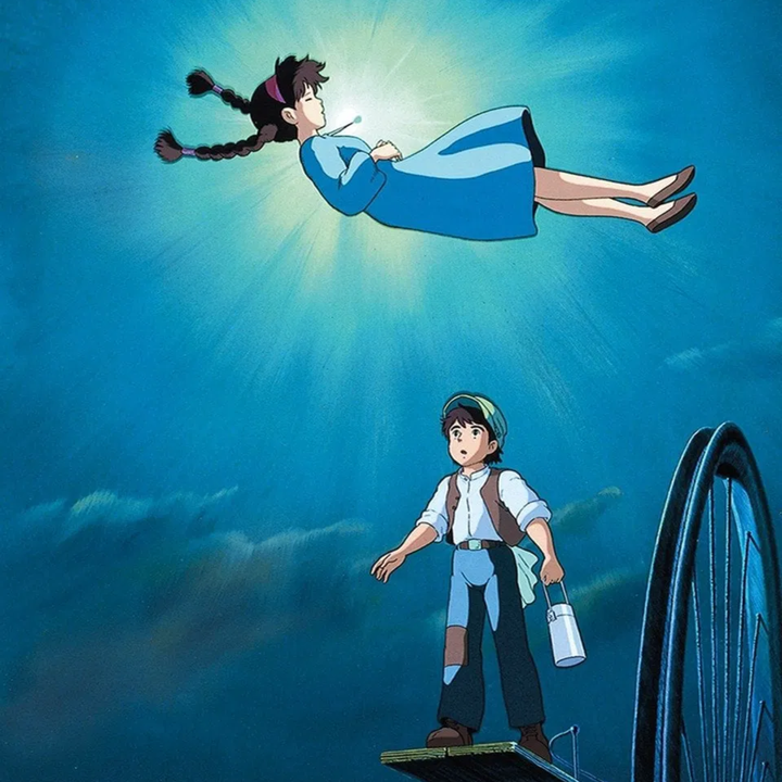 Animated scene of a girl floating in midair with a glowing light, while a boy stands below looking up at her