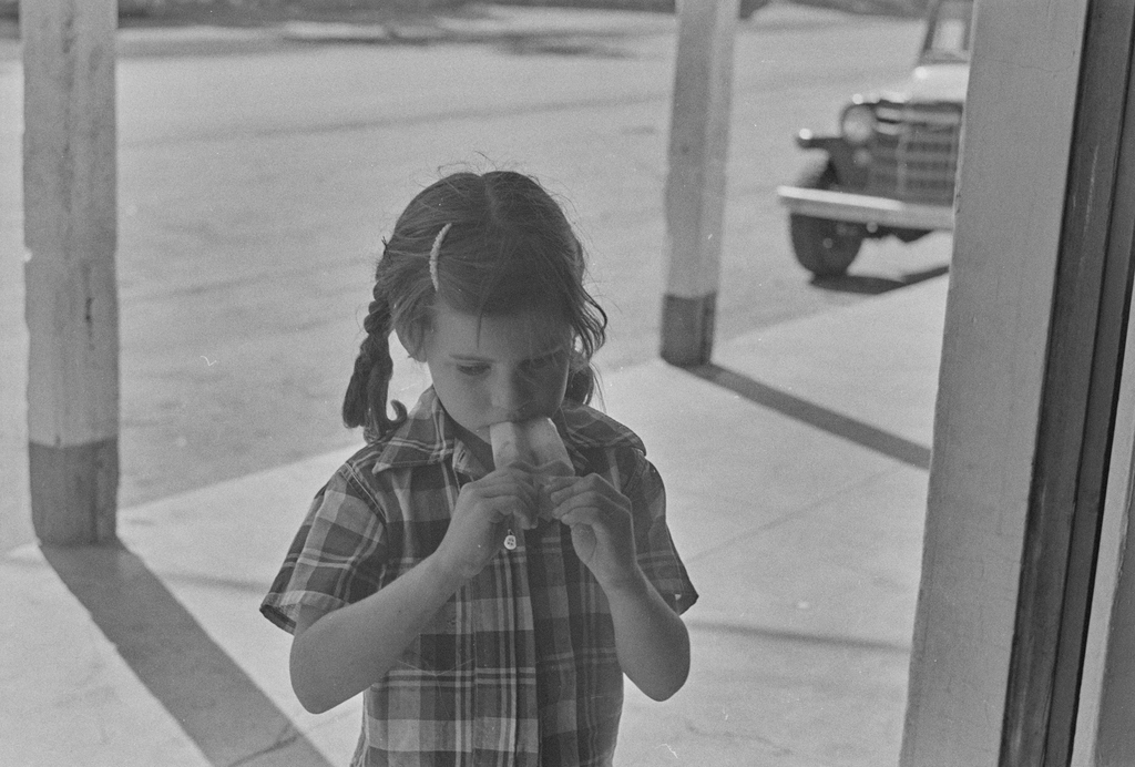 Young girl eating a popsicle in Monticello