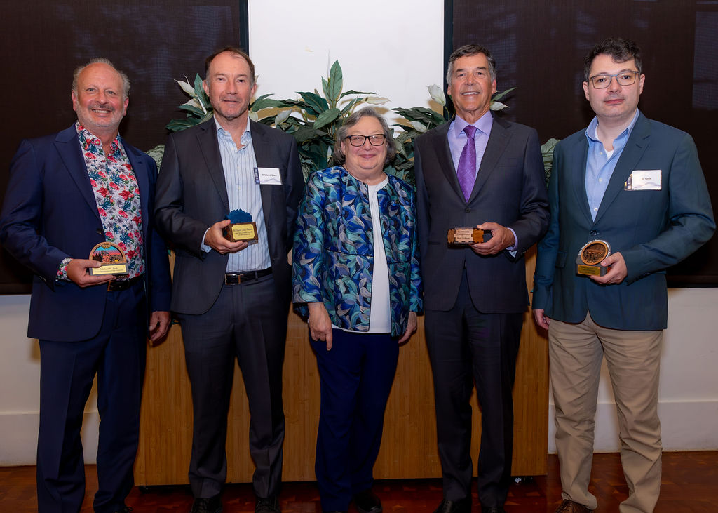 The four 2025 Chancellor's Innovation Impact Awards honorees with the UCSC chancellor.
