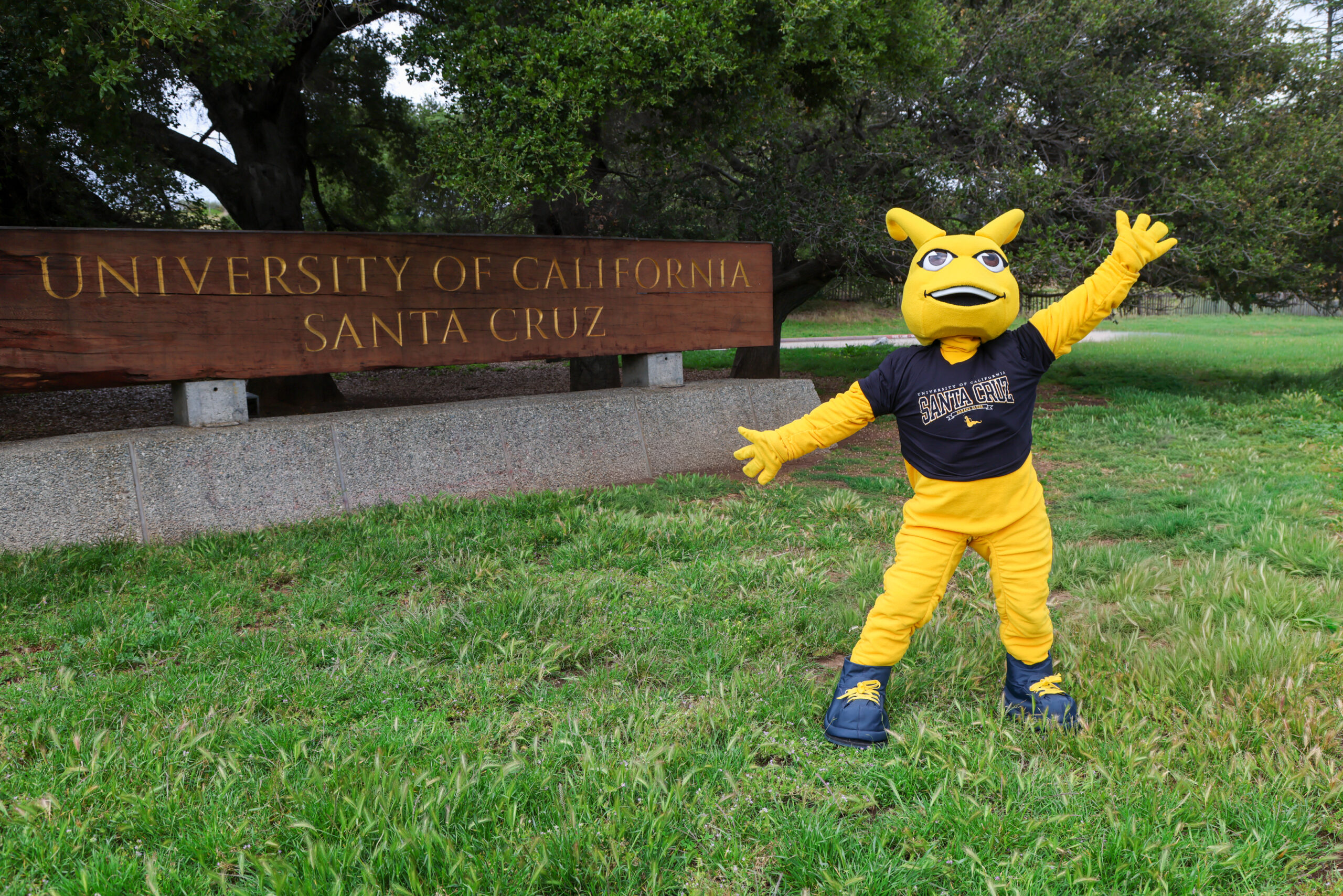 Sammy the Slug in front of the UC Santa Cruz entrance sign