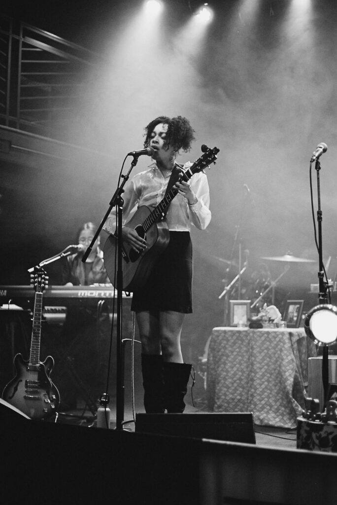 Black and White photo of August Lee Stevens performing 