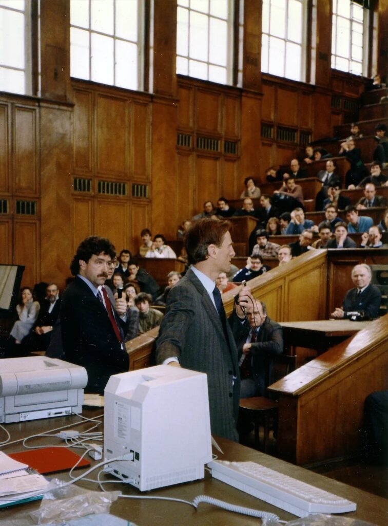 David Gleason in Moscow University alongside Apple CEO John Sculley.