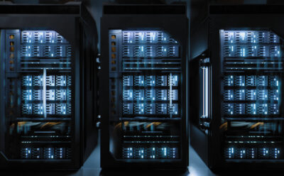 A large hallway with supercomputers inside a server room data center