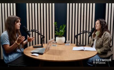 Podcast host and guest recording in studio