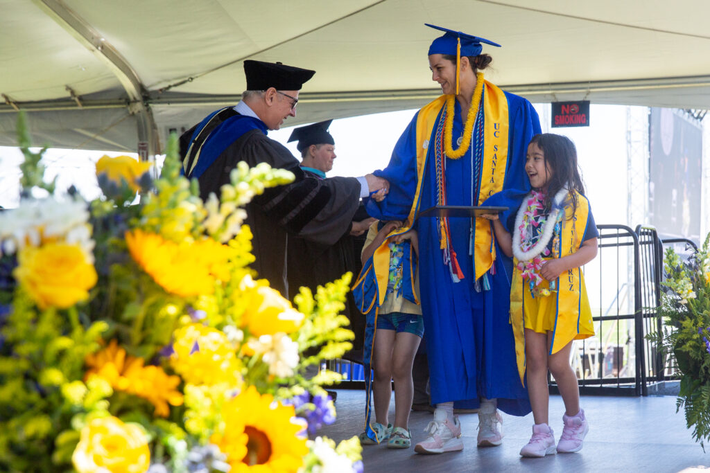UCSC graduate shares the milestone with her two children.