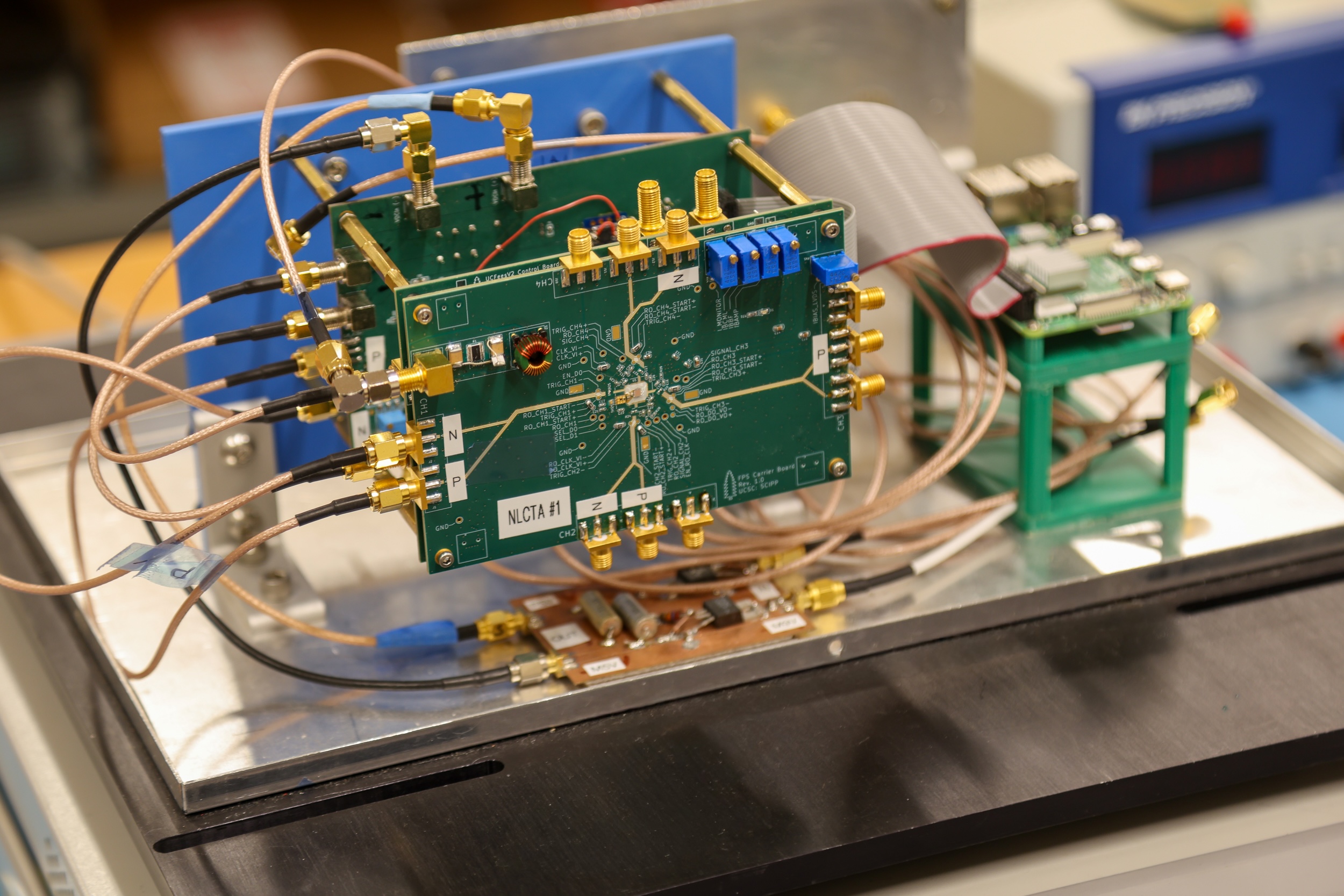 An electronic detection system setup featuring a green printed circuit board.