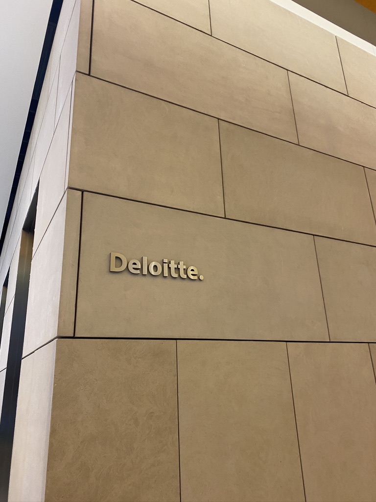 Deloitte engraved on wall