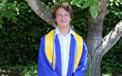 Brock Hrehor in graduation cap and gown