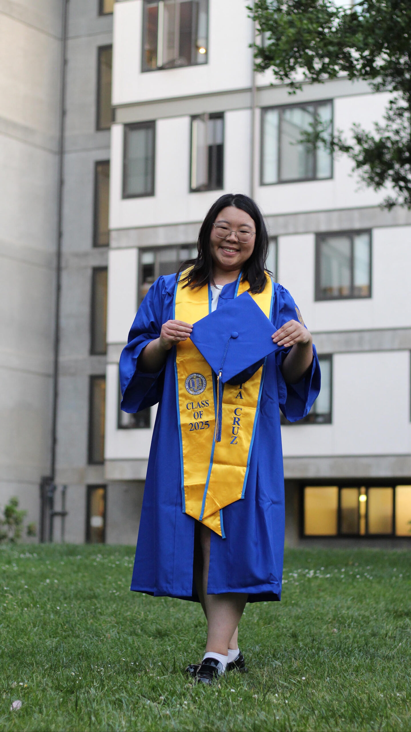 Evelyne Gong in graduation cap and gown