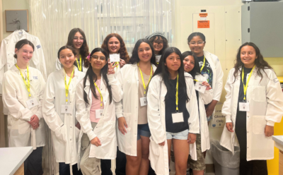 Group of Girls in Engineering participants wearing lab coats