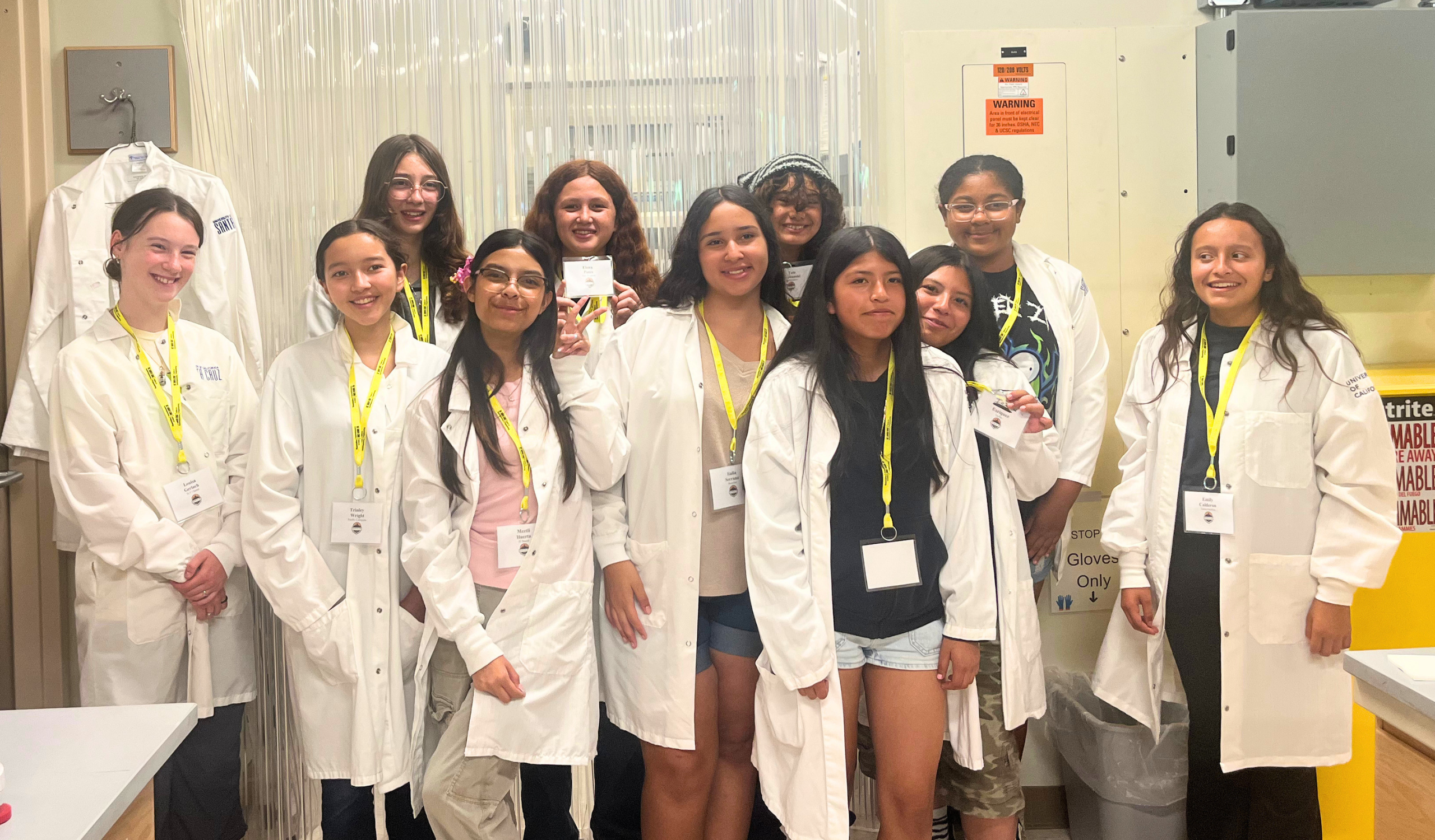 Group of Girls in Engineering participants wearing lab coats