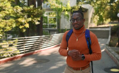UC Santa Cruz Ph.D. student standing outside