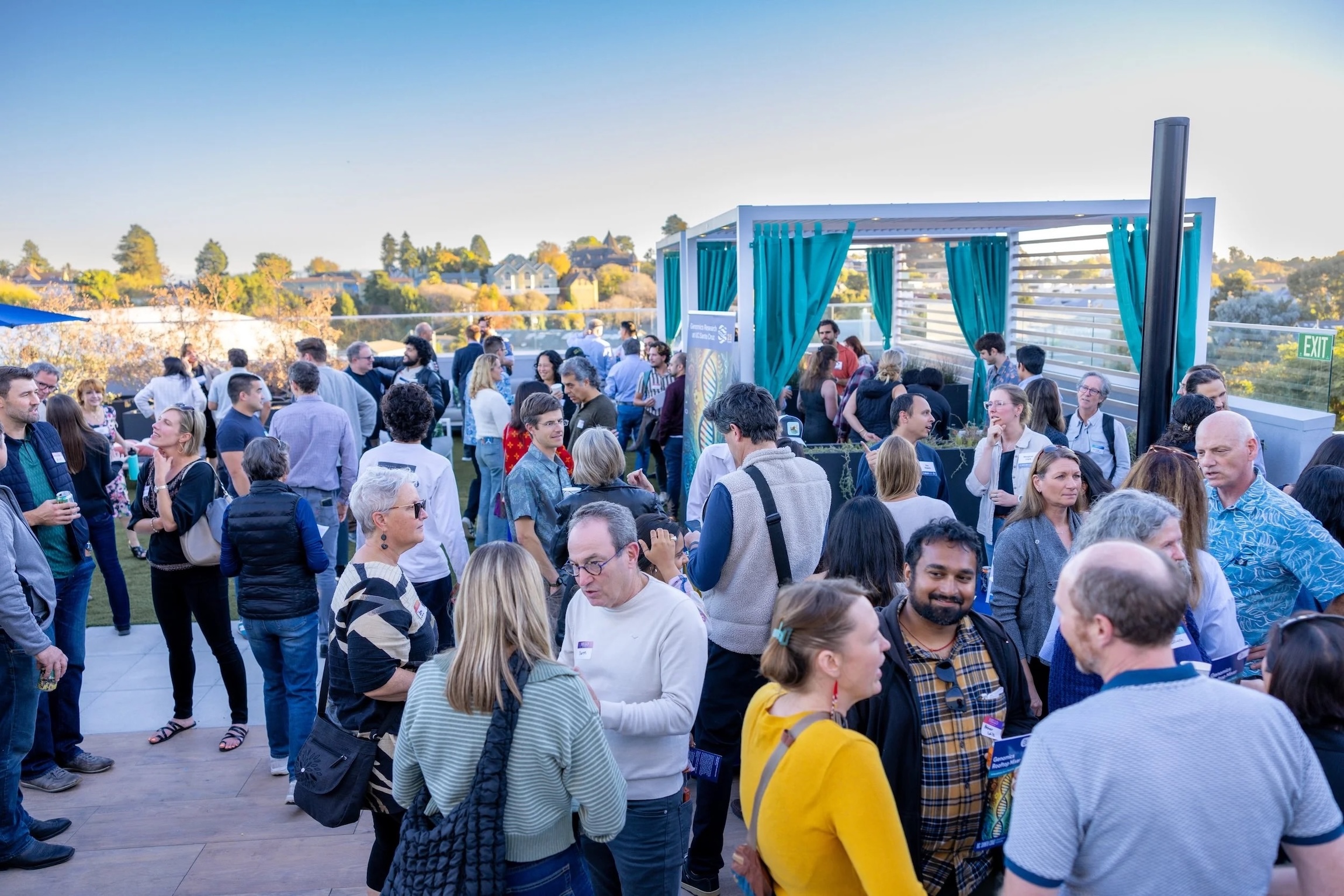 Event attendees mingling on crowded rooftop