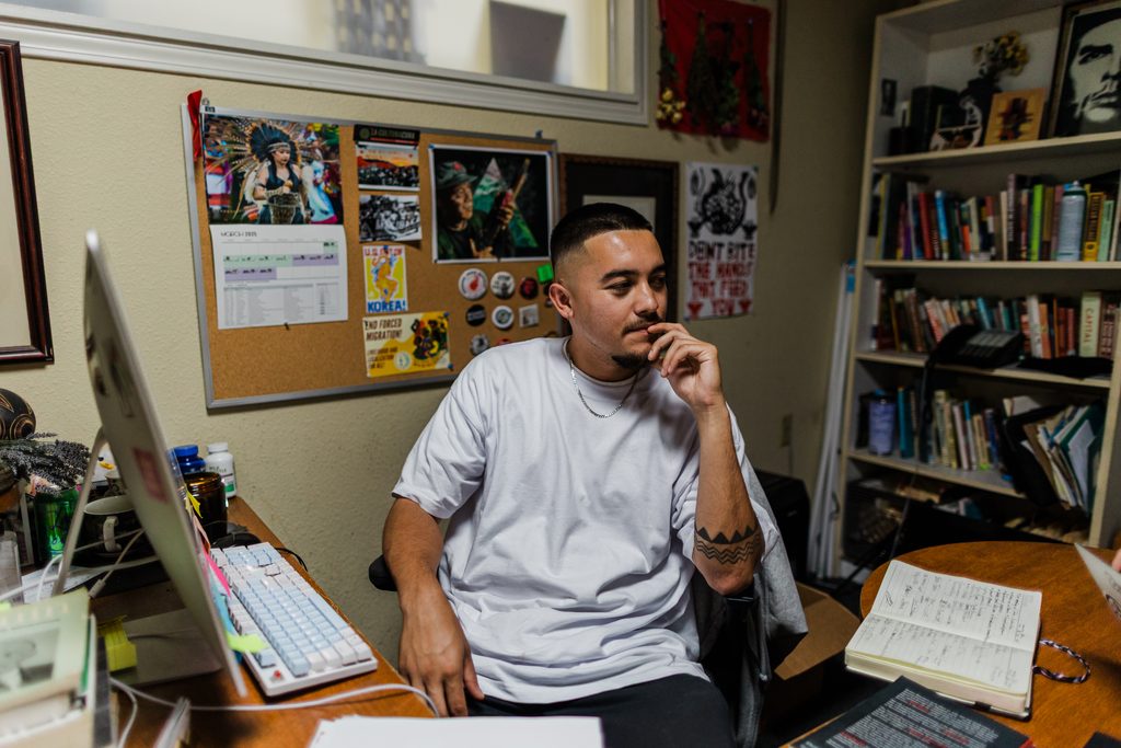 Josh Patsone sits at his desk at Barrios.