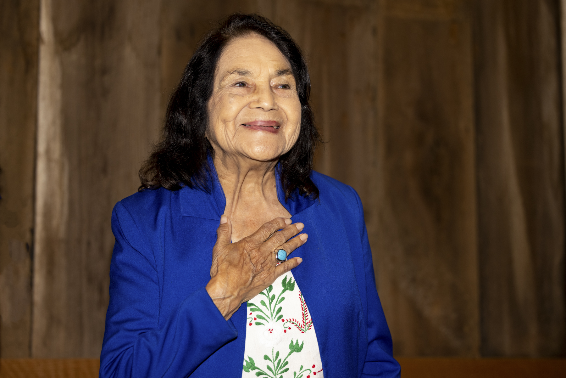 Dolores Huerta holds her hand over her heart