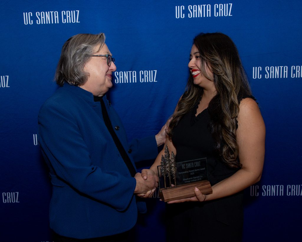 Chancellor Larive shakes hands with Stephanie Barron Lu.
