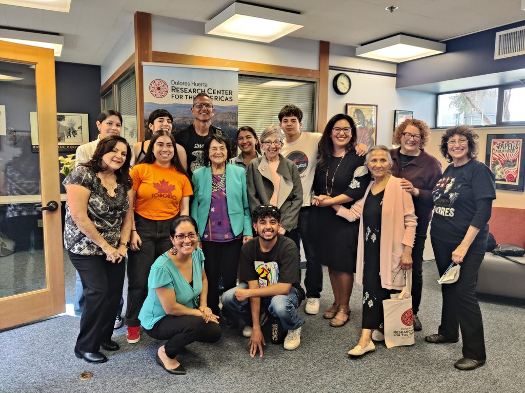 Faculty, students, staff, and community members meet with Dolores Huerta inside the Huerta Center