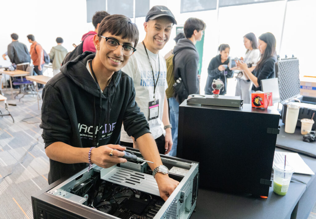 Student smiles at camera