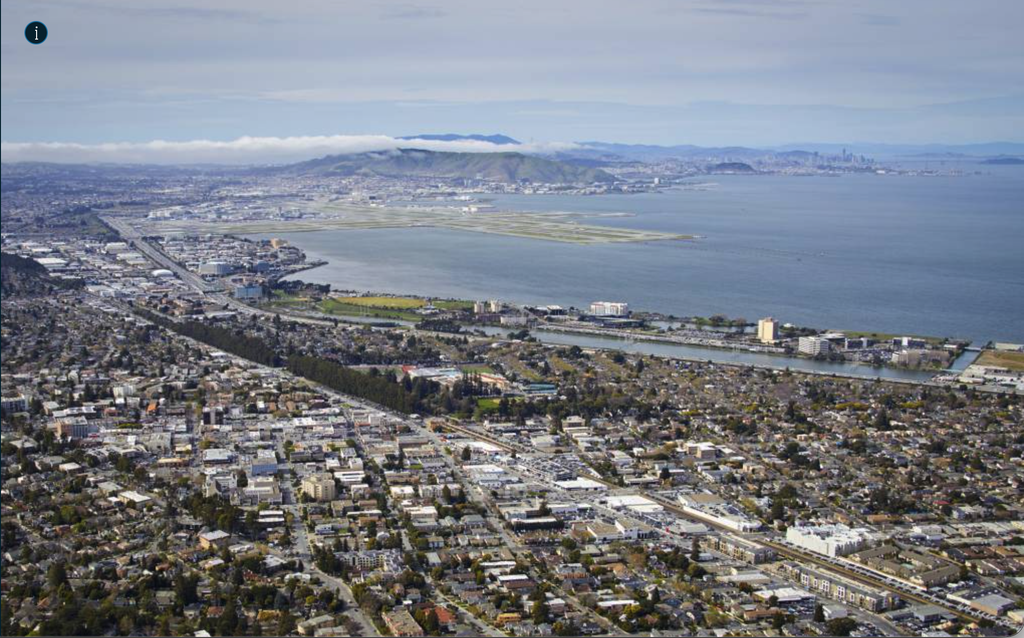 Aerial photo of the San Francisco Peninsula showing high-density development along a freeway corridor